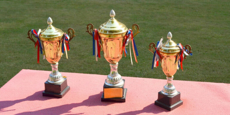 First, second, and third-place trophies.